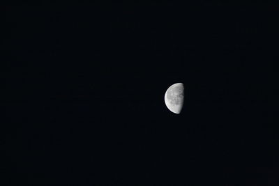 Low angle view of moon against sky at night