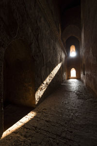 Illuminated corridor of historic building