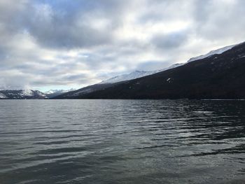View of calm sea against cloudy sky