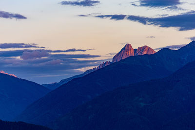 Scenic view of mountains against sky during sunset