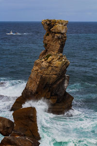 Scenic view of cabo carvoeirp rocks in sea against sky