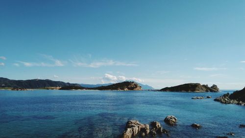 Scenic view of sea against blue sky