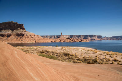 Scenic view of land against clear blue sky