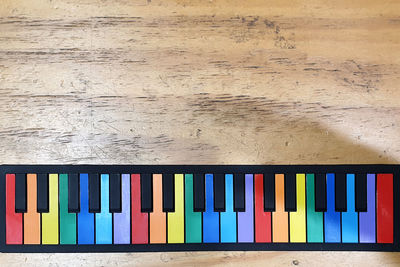 Directly above shot of multi colored pencils on table against wall