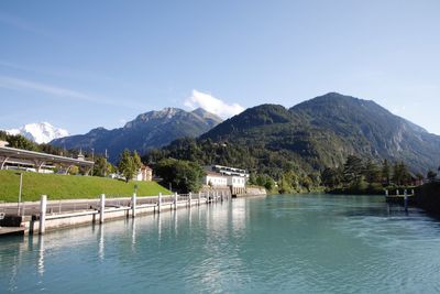 Scenic view of lake and mountains against sky