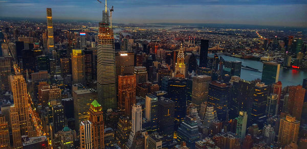 High angle view of illuminated cityscape against sky