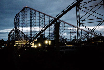 Low angle view of ferris wheel against sky