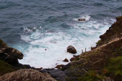 High angle view of rocks in sea