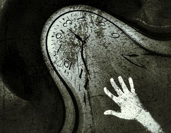 Close-up of human hand on old wall
