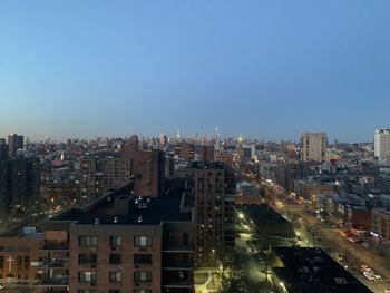 High angle view of illuminated buildings against sky