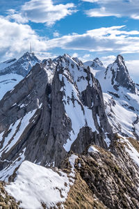 Scenic view of snowcapped mountains against sky