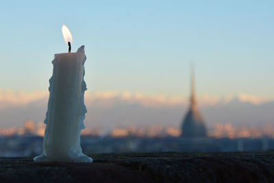 Candlelight. close up of candle in turin sunrise