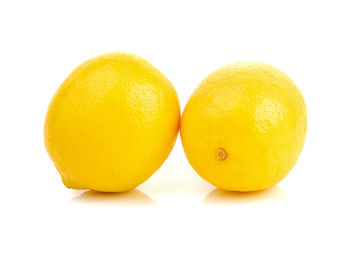 Close-up of oranges against white background