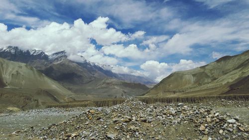 Scenic view of landscape and mountains against sky