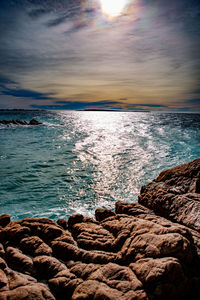 Scenic view of sea against sky during sunset