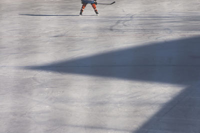 Low section of person ice skating