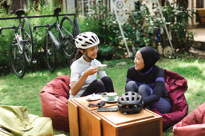 Female friends talking in backyard