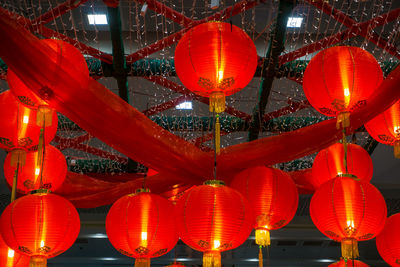 Illuminated lanterns hanging at night