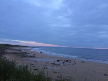 Scenic view of beach against sky