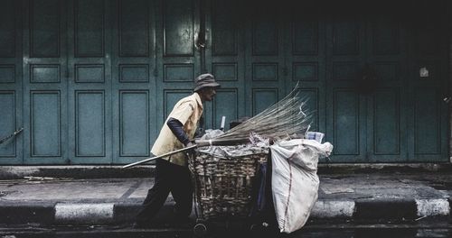 Man working against wall