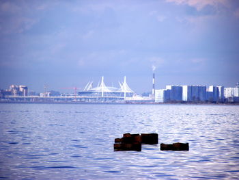 Commercial dock against sky in city