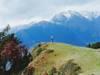 Man on mountain against sky