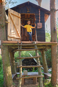 High angle view of man sitting on chair