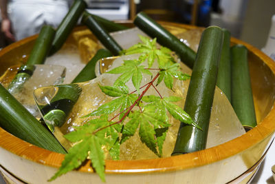 High angle view of leaves in bowl on table