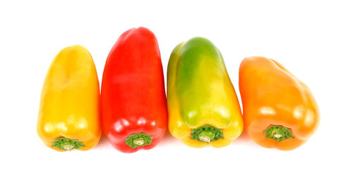 Close-up of bell peppers against white background