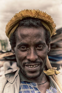 Close-up portrait of a smiling young man