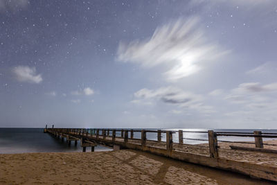 Scenic view of sea against sky at night