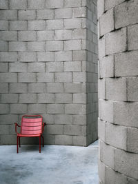 Empty chairs and chair against wall