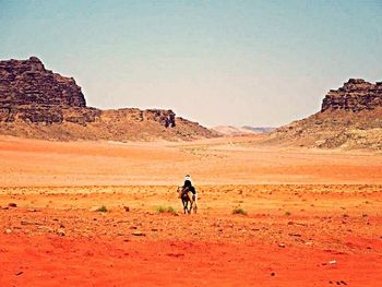 Scenic view of desert against clear sky