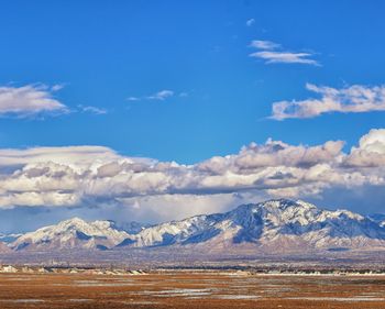 Scenic view of snowcapped mountains against sky