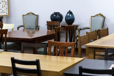 Empty chairs and tables in restaurant