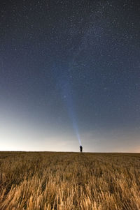 Scenic view of field against sky at night