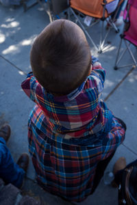 Rear view of people sitting outdoors