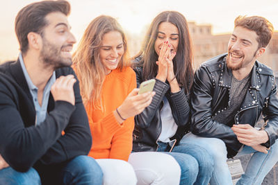 Group of people looking at friends in city