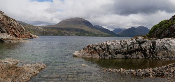 Panoramic view of lake and mountains against sky