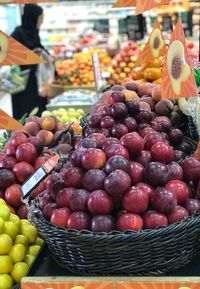 Fruits in basket for sale at market stall