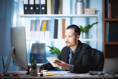 Man working on table in office