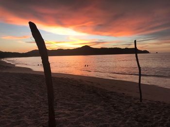 Scenic view of beach against sky during sunset