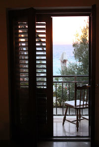 Chairs and table by window in house