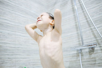 A little boy bathes in a bath. personal hygiene in childhood. high quality photo