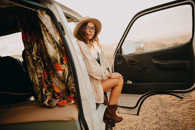 Woman sitting in car