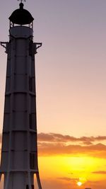 Low angle view of lighthouse against cloudy sky