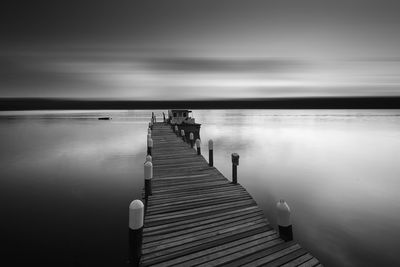 Pier over sea against sky