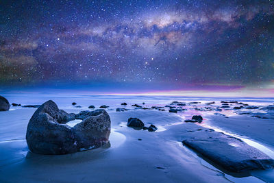 Scenic view of sea against sky at night