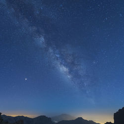Low angle view of star field against sky at night