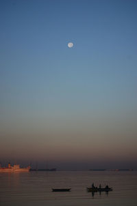 Scenic view of calm sea at sunset